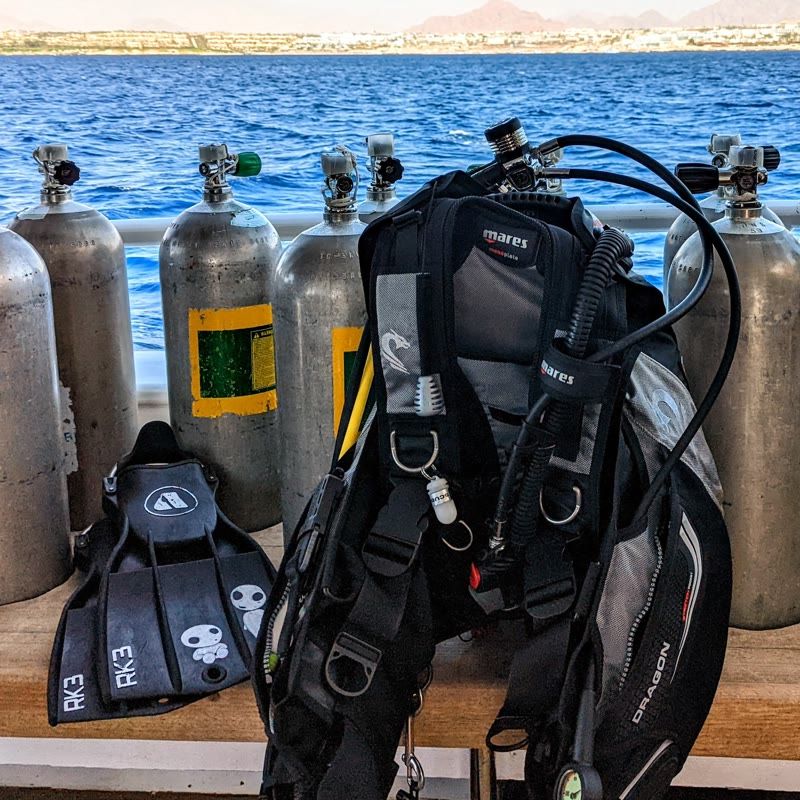 Dive gear on the deck of a boat.